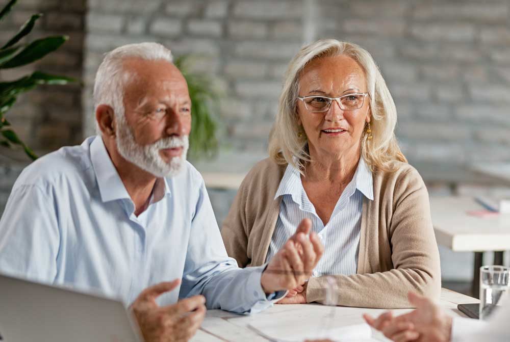 Elderly couple meeting about estate plan